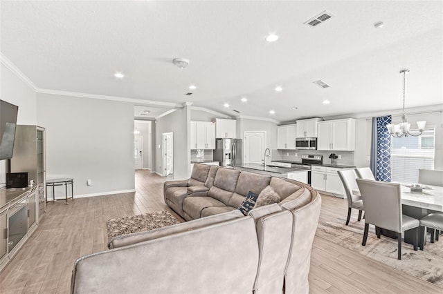 392 S Hamilton Springs Rd, Saint Augustine, FL 32084 - living room with crown molding, a chandelier, light wood-type flooring, vaulted ceiling, and recessed lighting