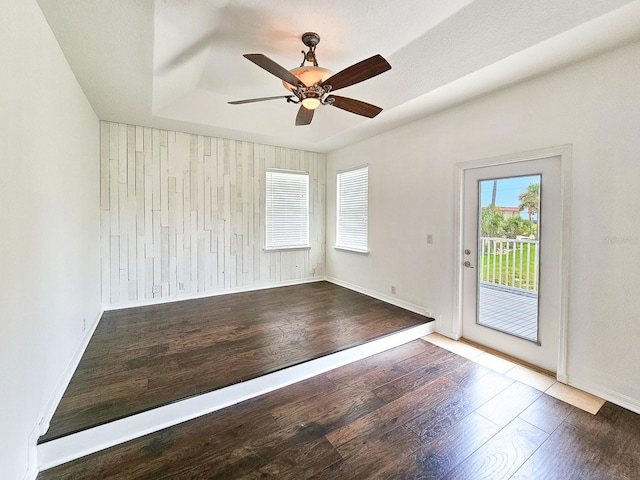 1528 N Daytona Ave, Flagler Beach, FL 32136 - empty room featuring wood finished floors, a ceiling fan, and wooden walls