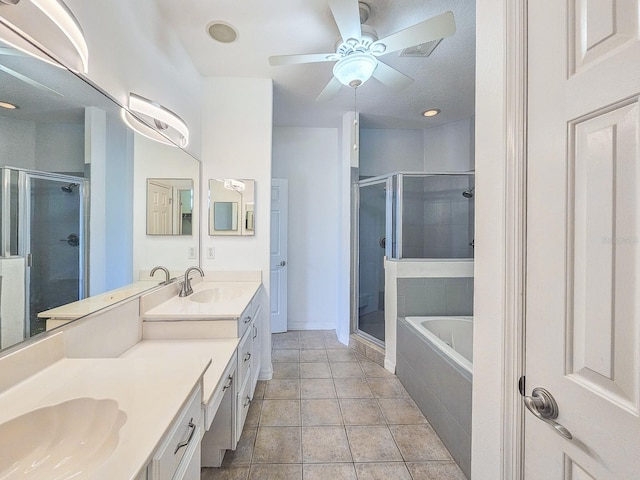 1528 N Daytona Ave, Flagler Beach, FL 32136 - full bath with double vanity, a shower stall, a garden tub, and ceiling fan