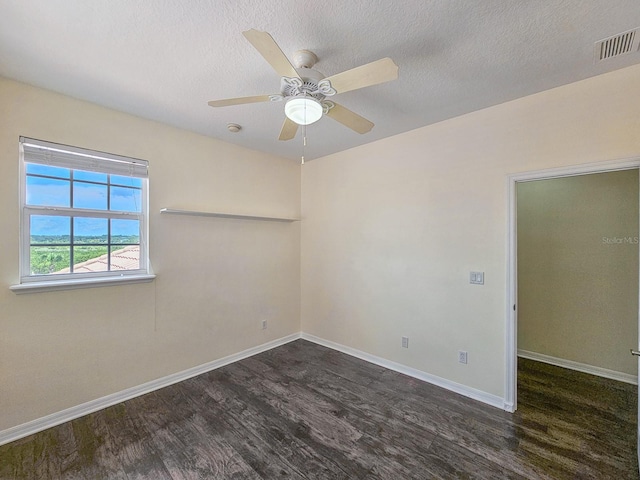 1528 N Daytona Ave, Flagler Beach, FL 32136 - unfurnished room featuring wood finished floors, ceiling fan, and a textured ceiling
