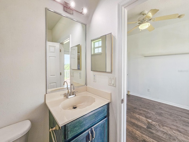 1528 N Daytona Ave, Flagler Beach, FL 32136 - half bathroom with vanity, wood finished floors, and a ceiling fan