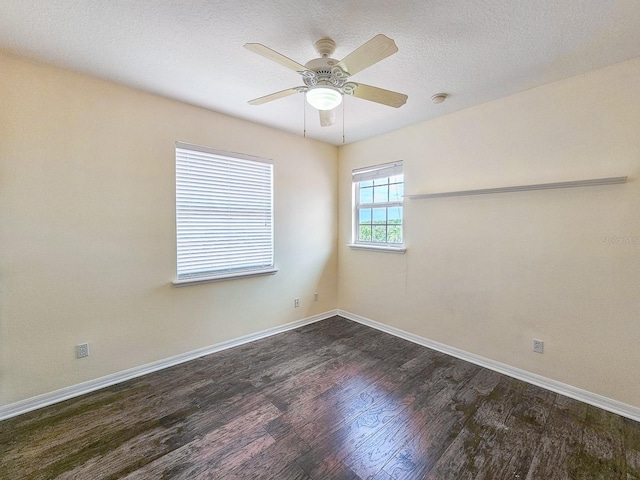 1528 N Daytona Ave, Flagler Beach, FL 32136 - unfurnished room featuring dark wood finished floors, a ceiling fan, and a textured ceiling