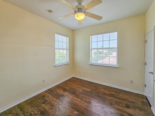 1528 N Daytona Ave, Flagler Beach, FL 32136 - empty room featuring dark wood-style flooring, a smoke detector, and a ceiling fan
