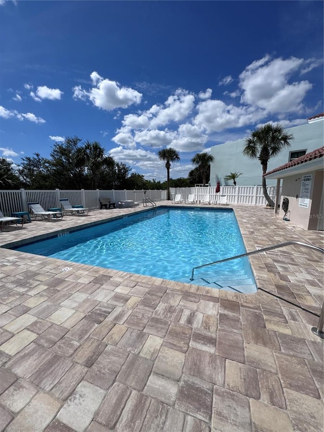1528 N Daytona Ave, Flagler Beach, FL 32136 - community pool featuring a patio