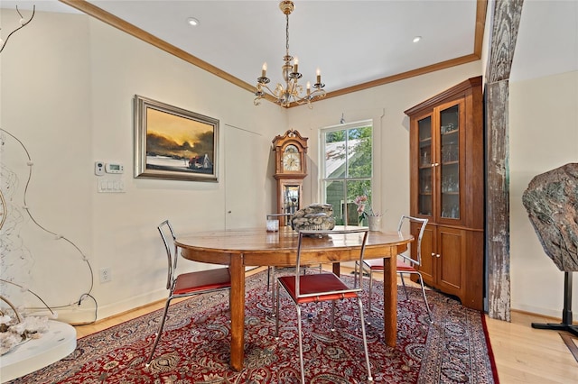 603 Front St, Welaka, FL 32193 - dining area with a chandelier, wood finished floors, crown molding, and recessed lighting
