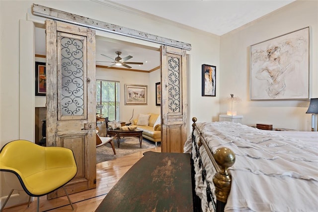 603 Front St, Welaka, FL 32193 - bedroom with ornamental molding and wood finished floors