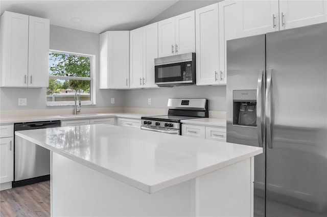 204 S Forsyth St, Bunnell, FL 32110 - kitchen with stainless steel appliances, light countertops, and white cabinetry
