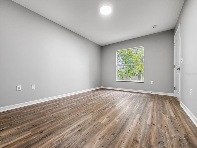 204 S Forsyth St, Bunnell, FL 32110 - empty room featuring wood finished floors and baseboards