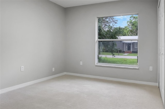 204 S Forsyth St, Bunnell, FL 32110 - spare room featuring carpet and baseboards