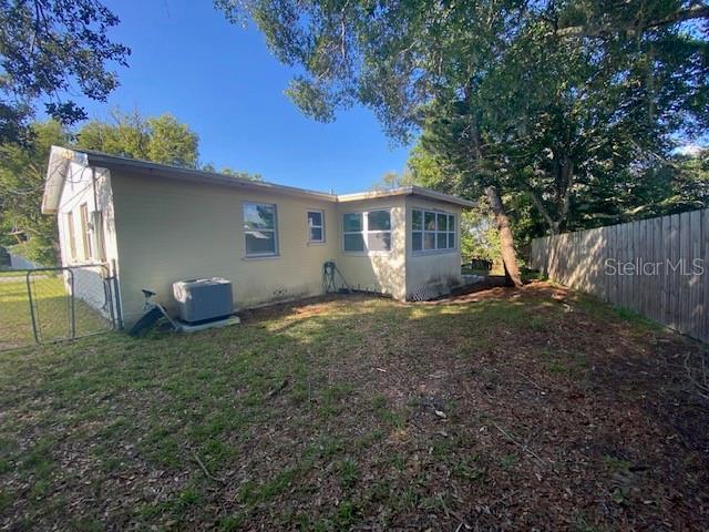 264 Sherwood Ln, Daytona Beach, FL 32117 - rear view of property with a fenced backyard