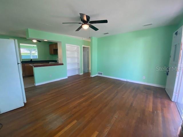 264 Sherwood Ln, Daytona Beach, FL 32117 - unfurnished living room featuring dark wood-style flooring and ceiling fan