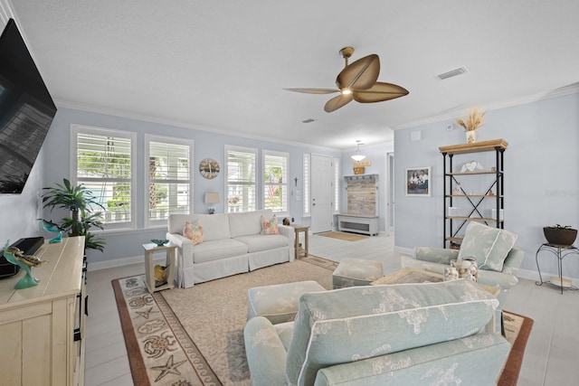 31 Hidden Treasure Dr, Palm Coast, FL 32137 - living room with ornamental molding, healthy amount of natural light, and a ceiling fan