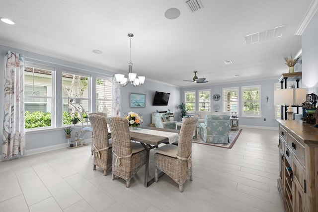 31 Hidden Treasure Dr, Palm Coast, FL 32137 - dining space featuring ornamental molding, a chandelier, and ceiling fan