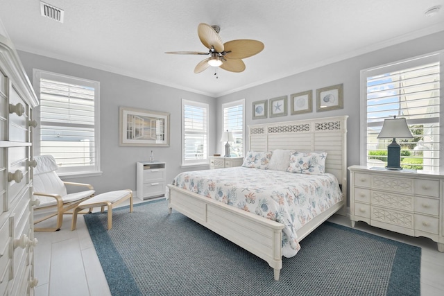 31 Hidden Treasure Dr, Palm Coast, FL 32137 - tiled bedroom with crown molding and a ceiling fan