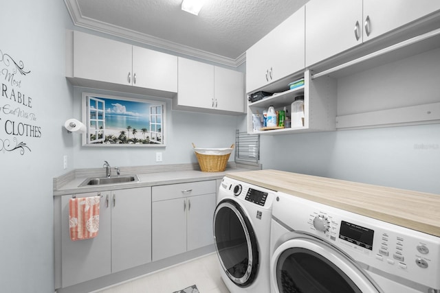 31 Hidden Treasure Dr, Palm Coast, FL 32137 - washroom featuring washer and clothes dryer, cabinet space, a textured ceiling, and crown molding
