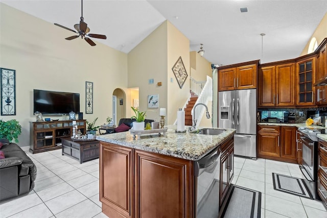 15522 NW 12th Ct, Pembroke Pines, FL 33028 - kitchen featuring stainless steel appliances, open floor plan, high vaulted ceiling, a ceiling fan, and light tile patterned floors