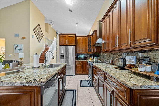 15522 NW 12th Ct, Pembroke Pines, FL 33028 - kitchen with appliances with stainless steel finishes, tasteful backsplash, light stone counters, light tile patterned floors, and high vaulted ceiling