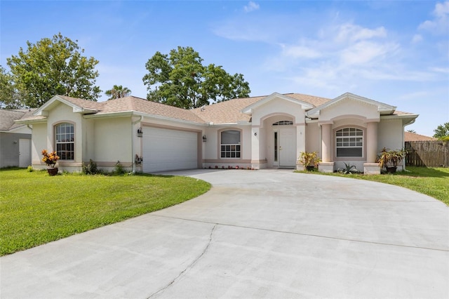 6 Prince Michael Ln, Palm Coast, FL 32164 - view of front of home with stucco siding, driveway, an attached garage, and a shingled roof
