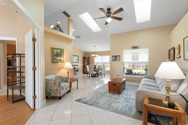 6 Prince Michael Ln, Palm Coast, FL 32164 - living area featuring a skylight, ceiling fan, a chandelier, high vaulted ceiling, and light tile patterned floors