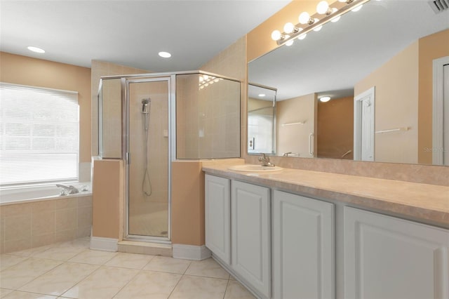 6 Prince Michael Ln, Palm Coast, FL 32164 - bathroom with tile patterned floors, a shower stall, vanity, a bath, and recessed lighting