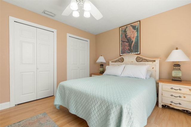 6 Prince Michael Ln, Palm Coast, FL 32164 - bedroom featuring light wood finished floors, ceiling fan, and multiple closets