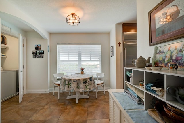 146 Palm Coast Resort Blvd Unit 501, Palm Coast, FL 32137 - dining room featuring baseboards and light tile patterned flooring
