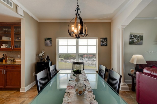 146 Palm Coast Resort Blvd Unit 501, Palm Coast, FL 32137 - dining room with ornate columns, light tile patterned floors, ornamental molding, and a chandelier