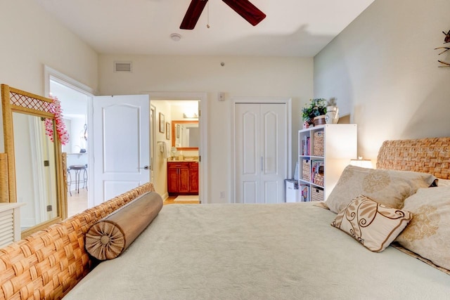 146 Palm Coast Resort Blvd Unit 501, Palm Coast, FL 32137 - bedroom with a closet, ensuite bath, and a ceiling fan