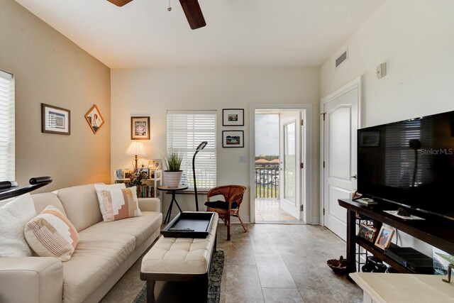 146 Palm Coast Resort Blvd Unit 501, Palm Coast, FL 32137 - living room featuring a ceiling fan
