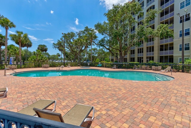 146 Palm Coast Resort Blvd Unit 501, Palm Coast, FL 32137 - community pool featuring a patio
