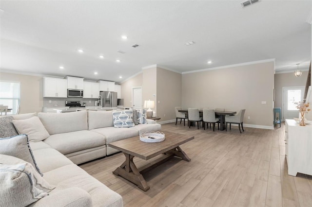 43 Lumber Jack Trl, Palm Coast, FL 32137 - living room with crown molding, light wood-style floors, and recessed lighting