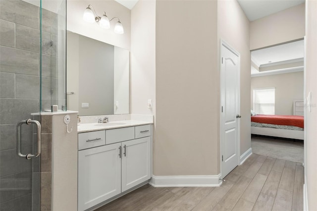 43 Lumber Jack Trl, Palm Coast, FL 32137 - full bathroom with wood finished floors, a shower stall, vanity, and ensuite bathroom