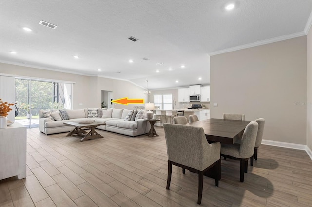 43 Lumber Jack Trl, Palm Coast, FL 32137 - dining room featuring crown molding, healthy amount of natural light, wood finished floors, and recessed lighting