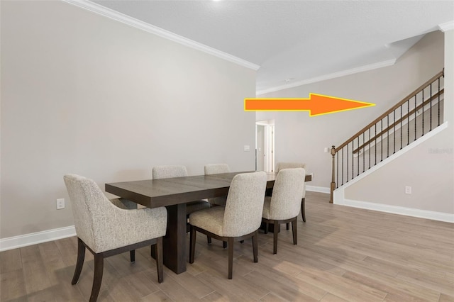 43 Lumber Jack Trl, Palm Coast, FL 32137 - dining room with crown molding, stairs, and wood finished floors