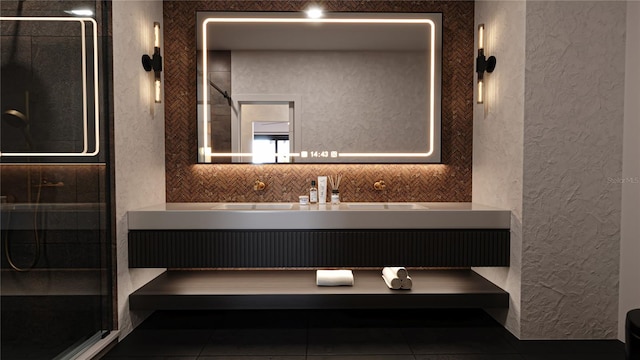 2360 Ocean Shore Blvd Unit 11, Ormond Beach, FL 32176 - bathroom with a textured wall, a stall shower, vanity, and tile patterned flooring