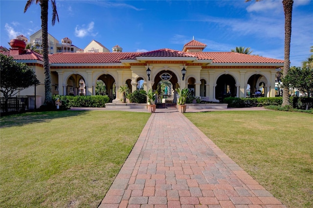 200 Ocean Crest Dr Unit 1111, Palm Coast, FL 32137 - view of front facade featuring a tile roof and a front lawn