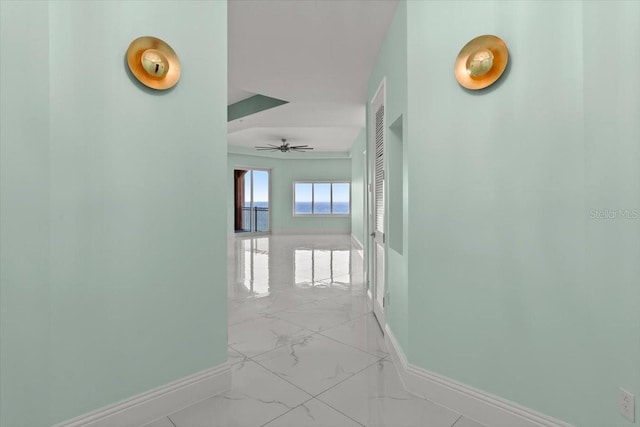200 Ocean Crest Dr Unit 1111, Palm Coast, FL 32137 - corridor featuring baseboards and light marble finish floors