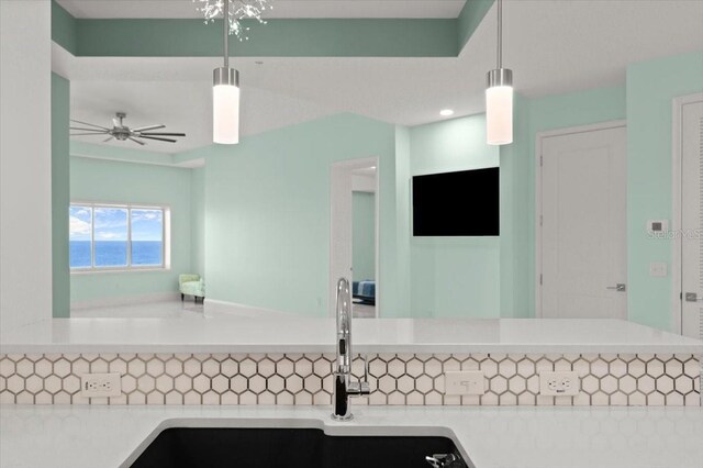 200 Ocean Crest Dr Unit 1111, Palm Coast, FL 32137 - kitchen featuring light countertops, a ceiling fan, and pendant lighting