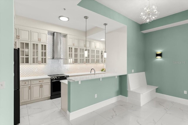 200 Ocean Crest Dr Unit 1111, Palm Coast, FL 32137 - kitchen with electric range, wall chimney exhaust hood, light marble finish flooring, and a peninsula