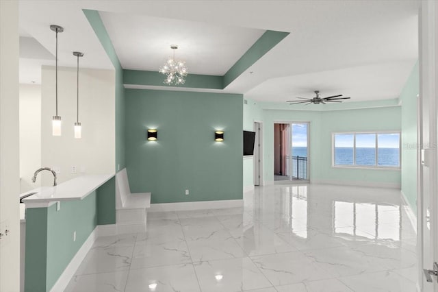 200 Ocean Crest Dr Unit 1111, Palm Coast, FL 32137 - spare room featuring light marble finish floors, a chandelier, and a ceiling fan