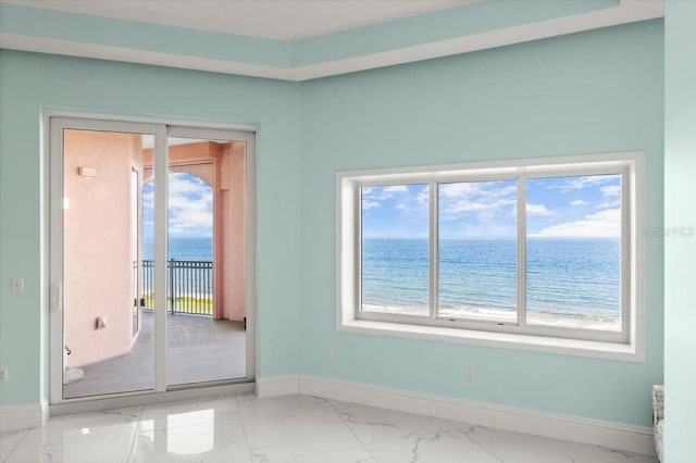 200 Ocean Crest Dr Unit 1111, Palm Coast, FL 32137 - empty room featuring marble look tiles, a water view, and plenty of natural light