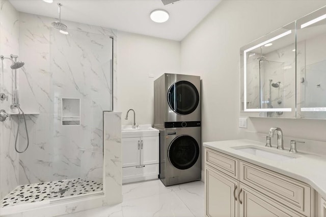 200 Ocean Crest Dr Unit 1111, Palm Coast, FL 32137 - bathroom featuring stacked washer and clothes dryer, marble tiled floors, a marble finish shower, and two vanities