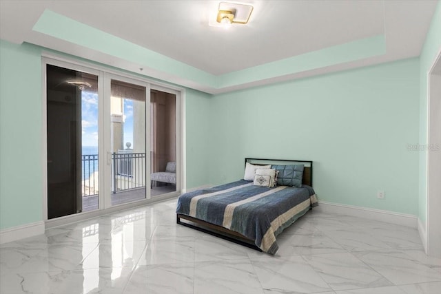 200 Ocean Crest Dr Unit 1111, Palm Coast, FL 32137 - bedroom featuring marble finish flooring, access to outside, and a tray ceiling
