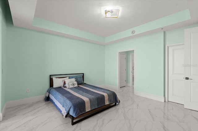 200 Ocean Crest Dr Unit 1111, Palm Coast, FL 32137 - bedroom with a tray ceiling and light marble finish flooring