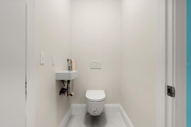 200 Ocean Crest Dr Unit 1111, Palm Coast, FL 32137 - bathroom with baseboards and tile patterned flooring