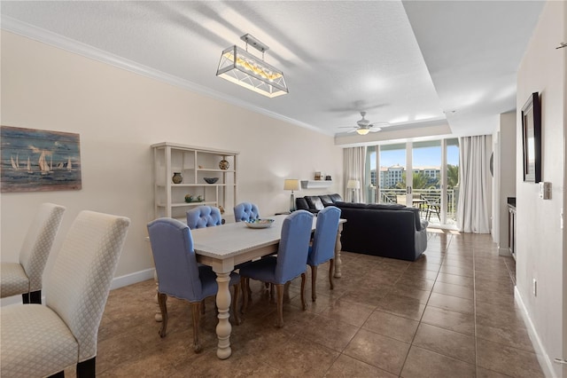 102 Yacht Harbor Dr Unit 475, Palm Coast, FL 32137 - tiled dining area featuring crown molding, ceiling fan, and expansive windows