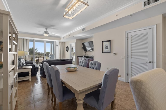 102 Yacht Harbor Dr Unit 475, Palm Coast, FL 32137 - tiled dining area featuring crown molding, ceiling fan, and a textured ceiling