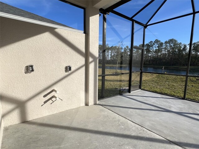 219 Hawthorn Ave, Palm Coast, FL 32164 - unfurnished sunroom featuring a water view and view of scattered trees