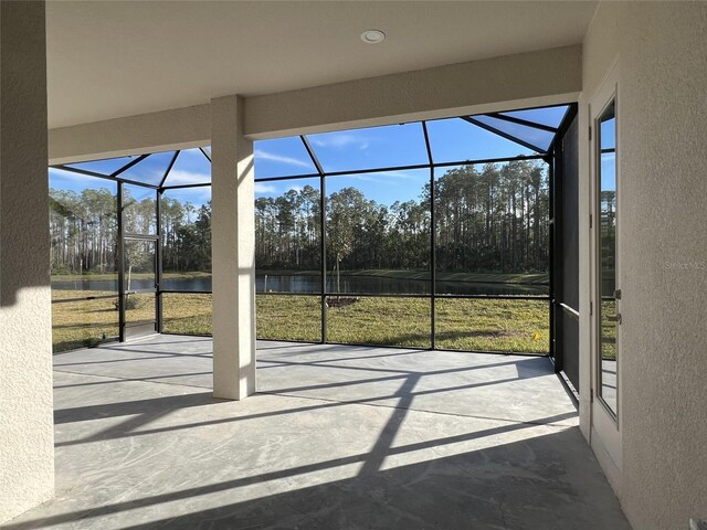 219 Hawthorn Ave, Palm Coast, FL 32164 - unfurnished sunroom featuring a water view and view of wooded area
