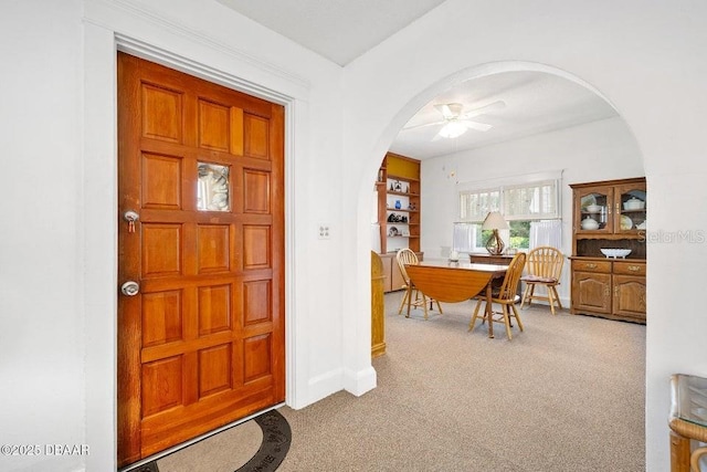 918 N Wild Olive Ave, Daytona Beach, FL 32118 - carpeted foyer with arched walkways and ceiling fan